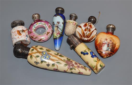 Eight assorted late 19th/early 20th century silver or white metal mounted painted porcelain scent bottles, largest 12.7cm.